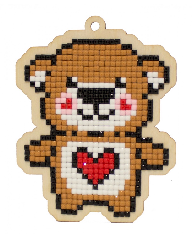 small teddy bear with heart on chest
