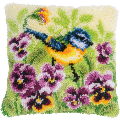 Blue tit on pansies