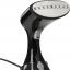 Vertical steamer with fabric brush