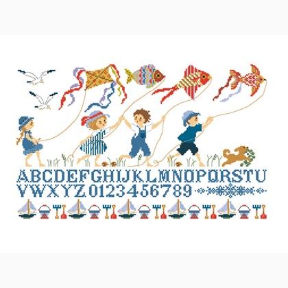 ABC children flying kites at sea