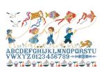 ABC children flying kites at sea